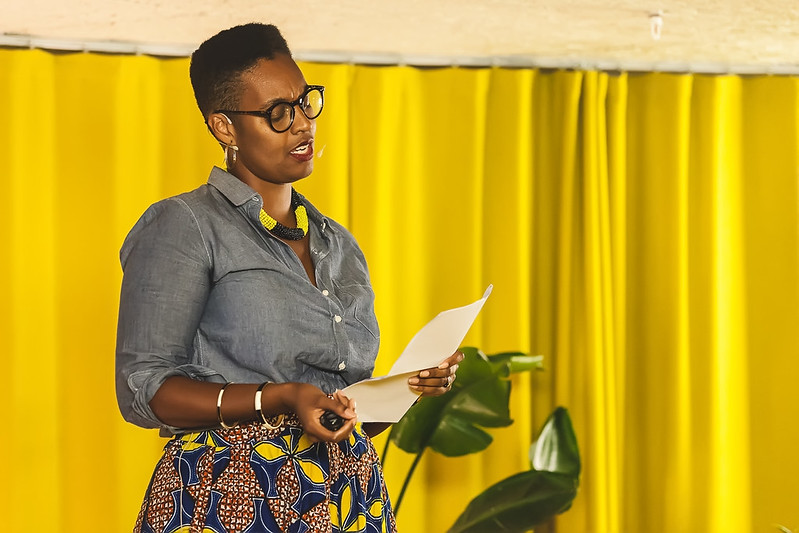 Image depicts publisher Sharmaine Lovegrove speaking at an event