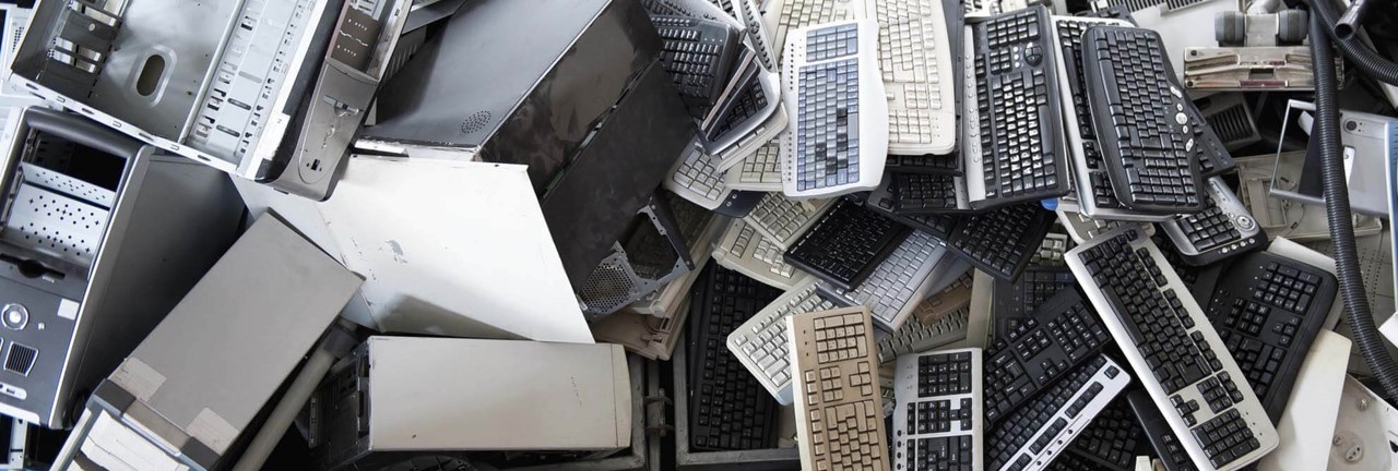 A pile of electronic waste, including TVs, keyboards and computers
