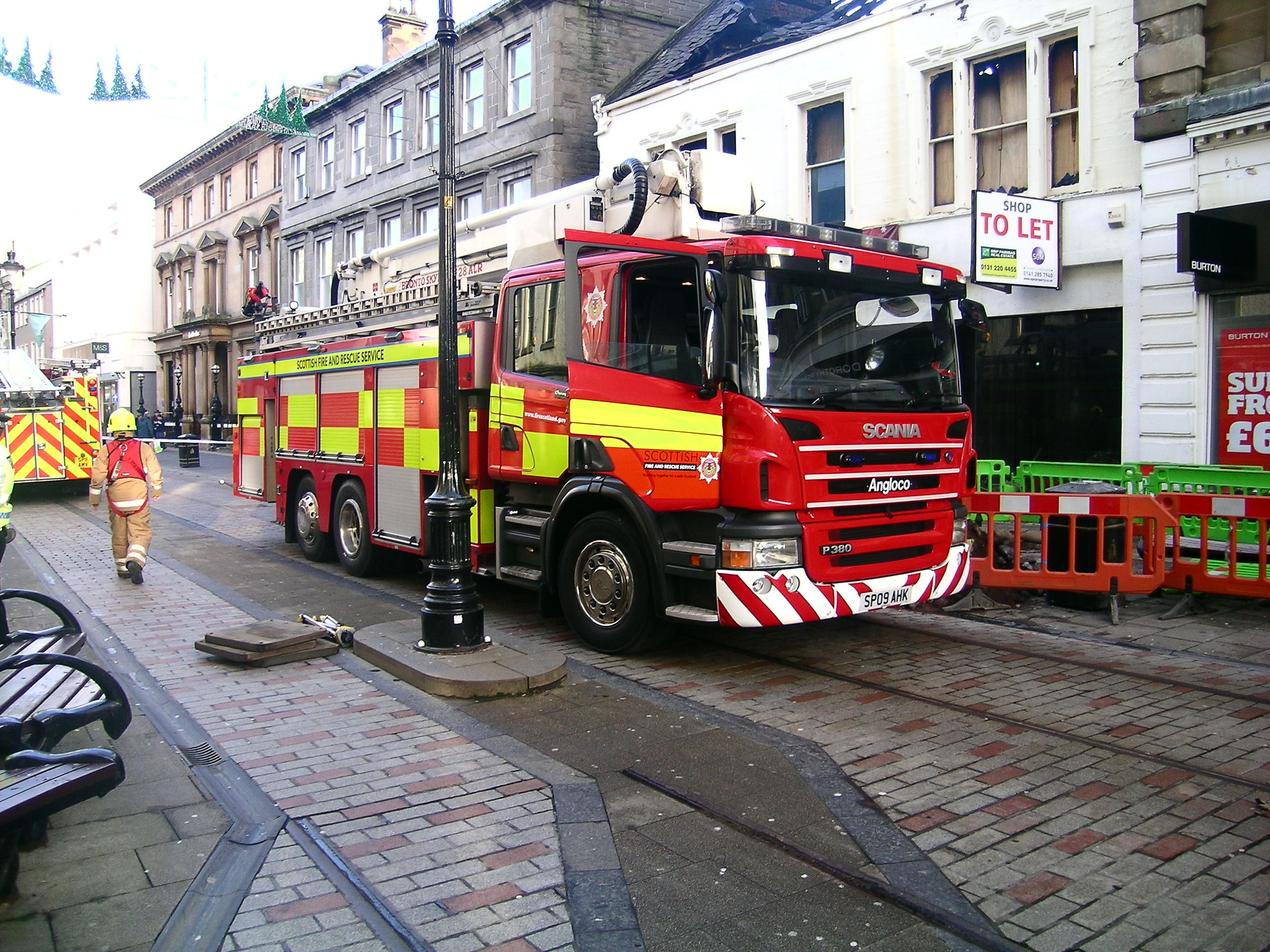 A fire engine with yellow Battenburg stripes.