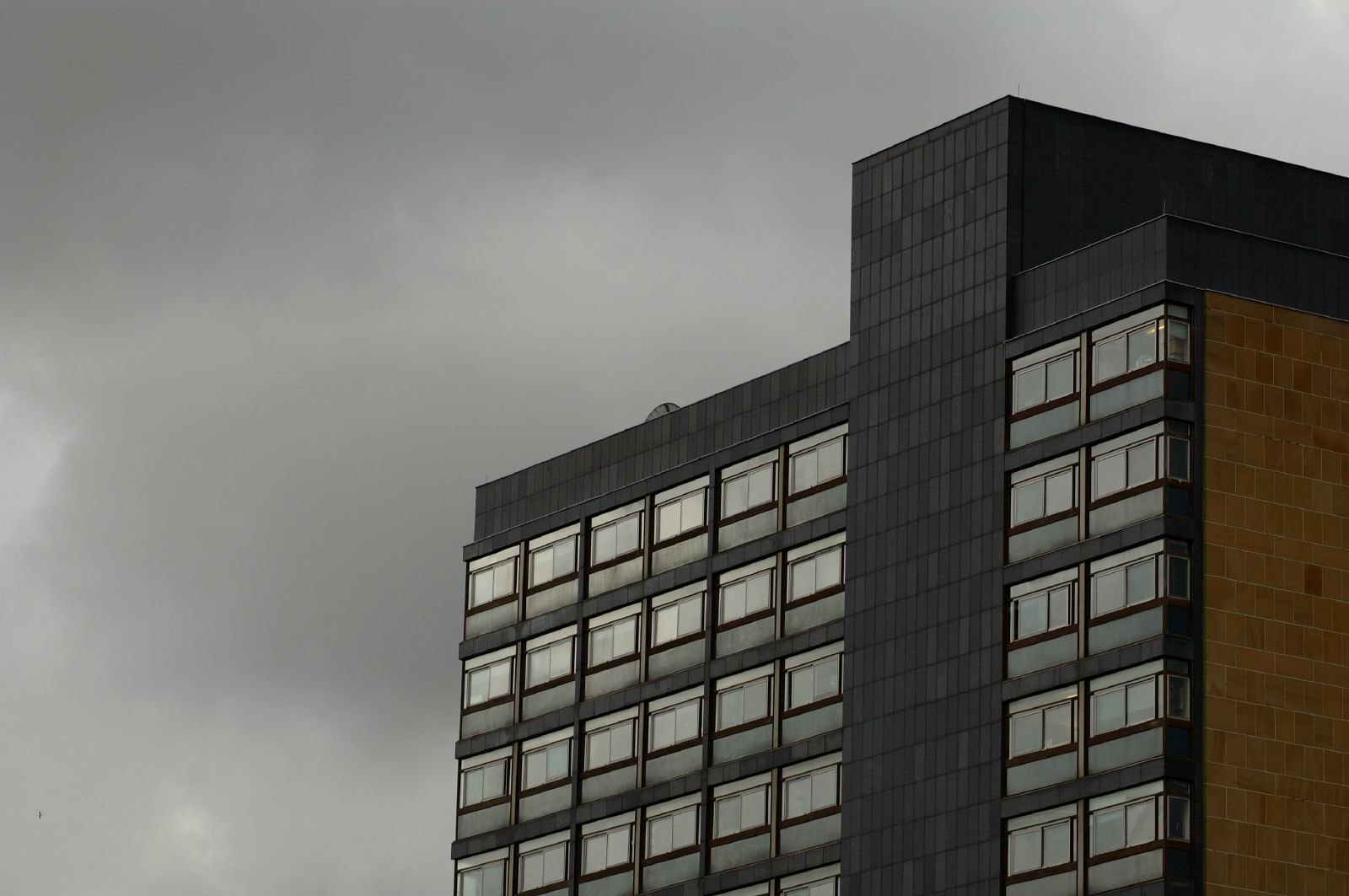 40 George Square, a 1960s teaching building, against a gray sky.