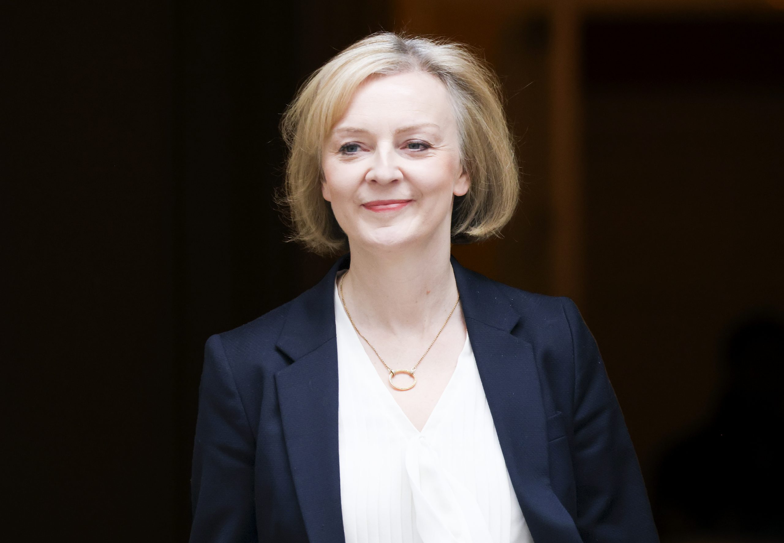 A photo of the current Prime Minister Liz Truss leaving No 10 Downing Street leaving for Prime Minister's Questions.