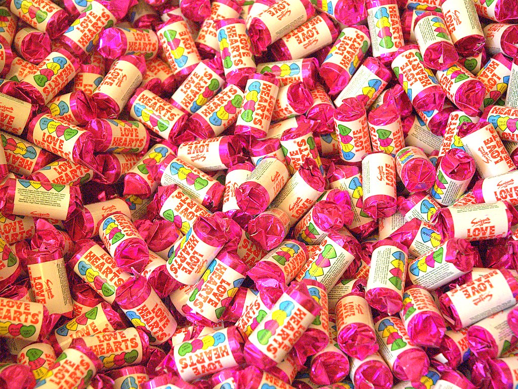 Piles of love heart sweets