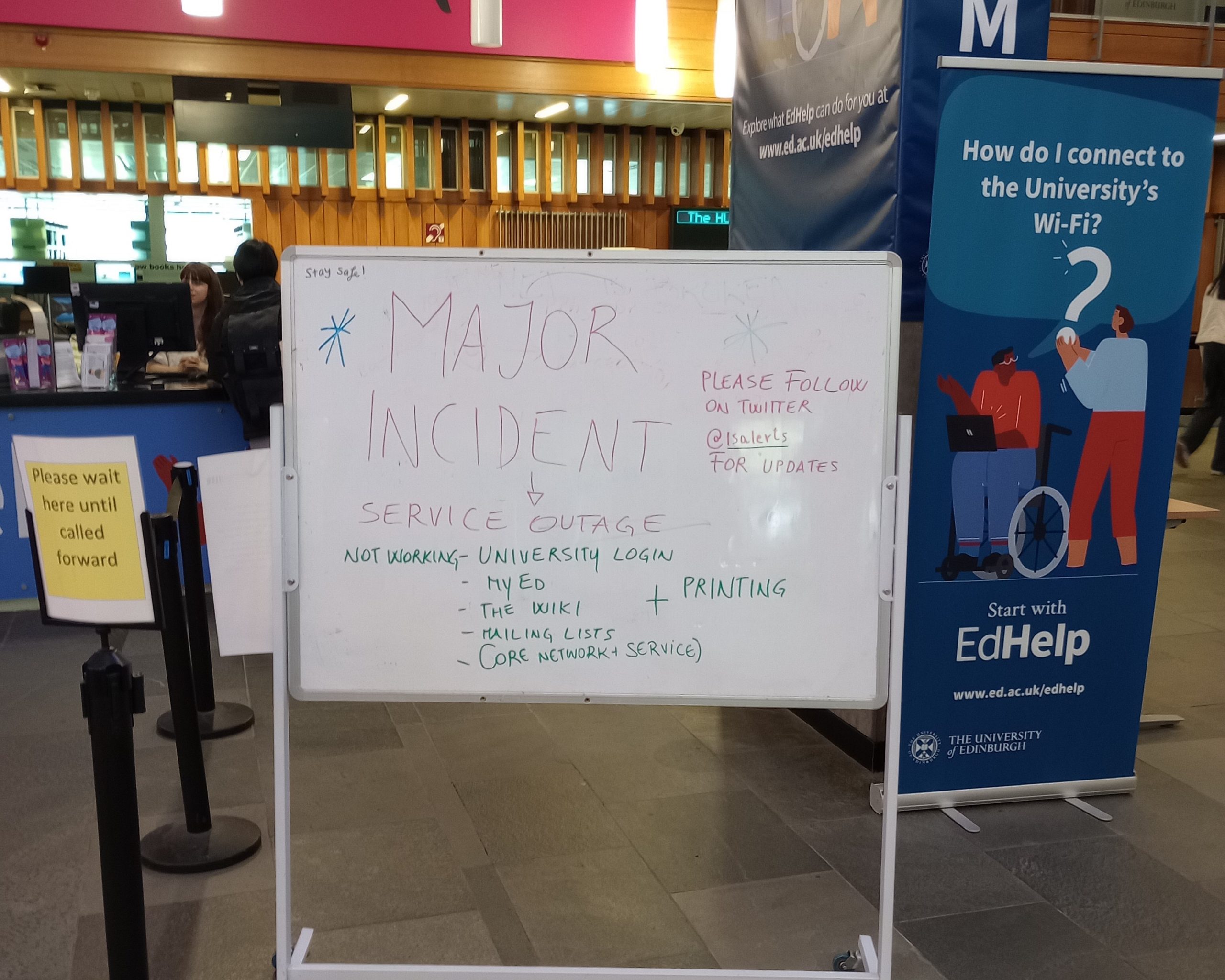 A sign announcing the outage of several University of Edinburgh services