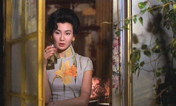 Maggie Cheung in "In the Mood for Love" holding a glass.