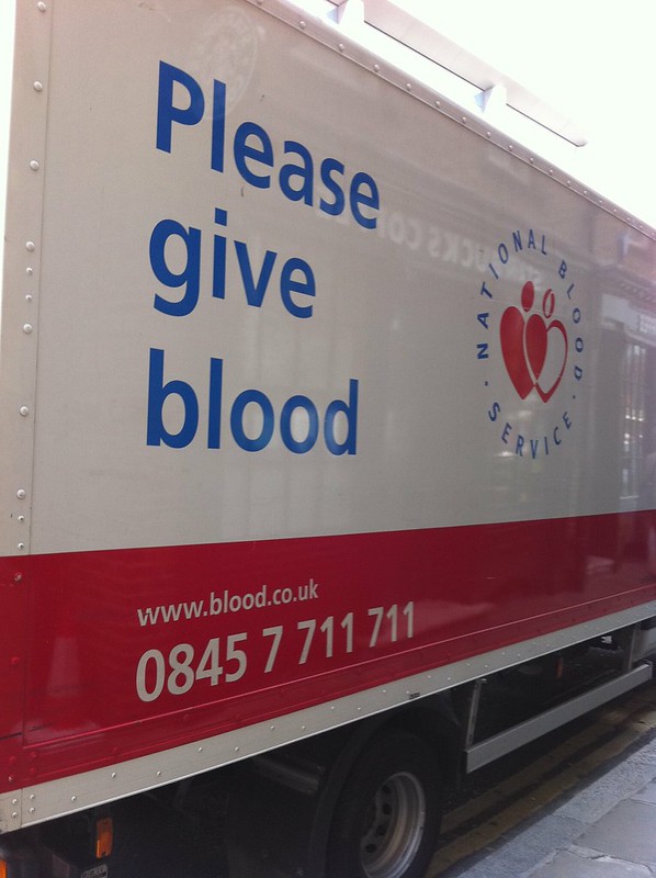 image of a blood donation van that says please give blood