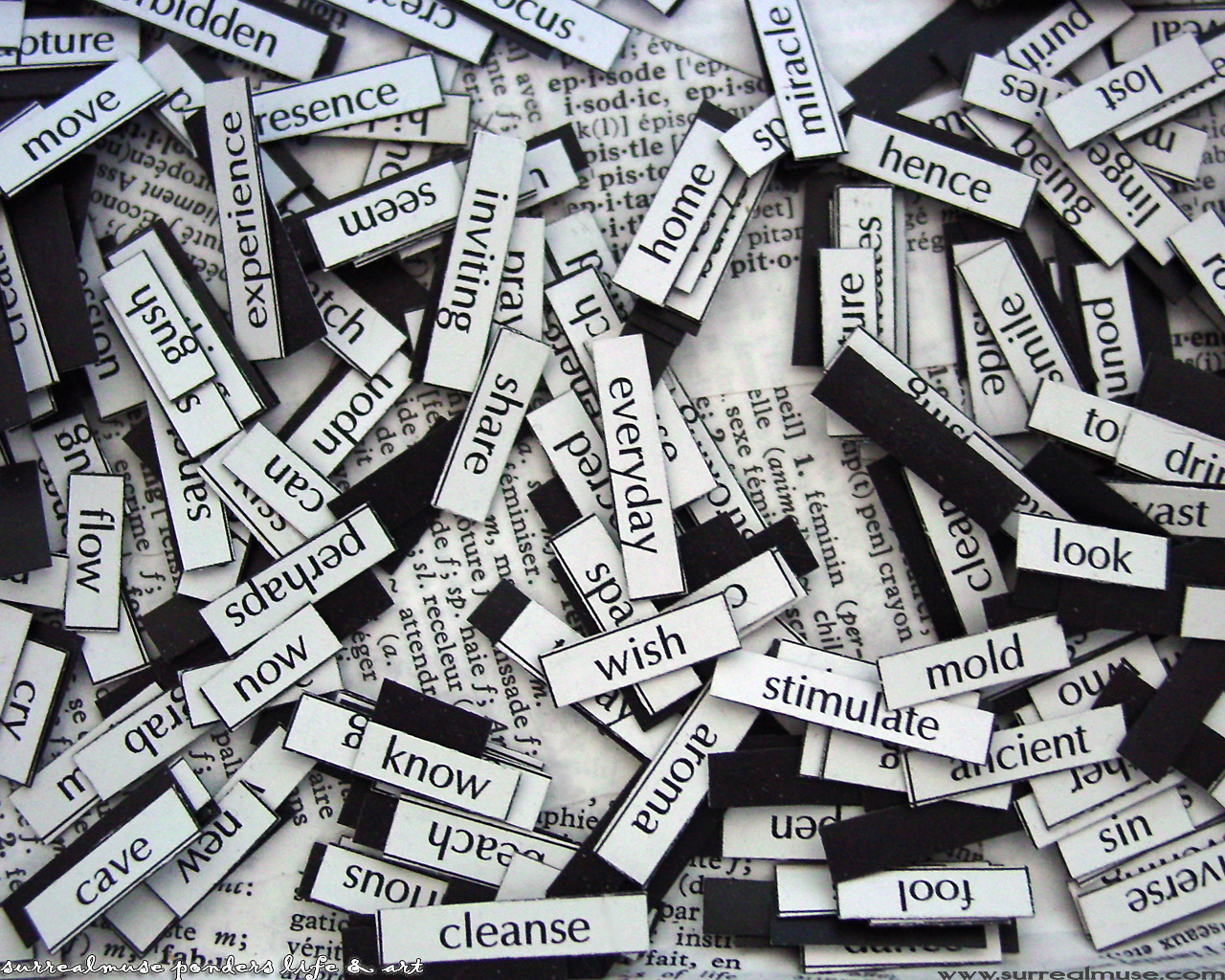 Black and white image of a pile of word fridge-magnets