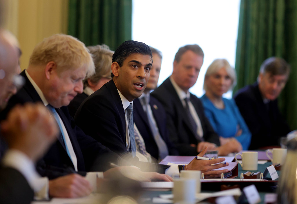 Rishi Sunak sat at a table with other members of cabinet