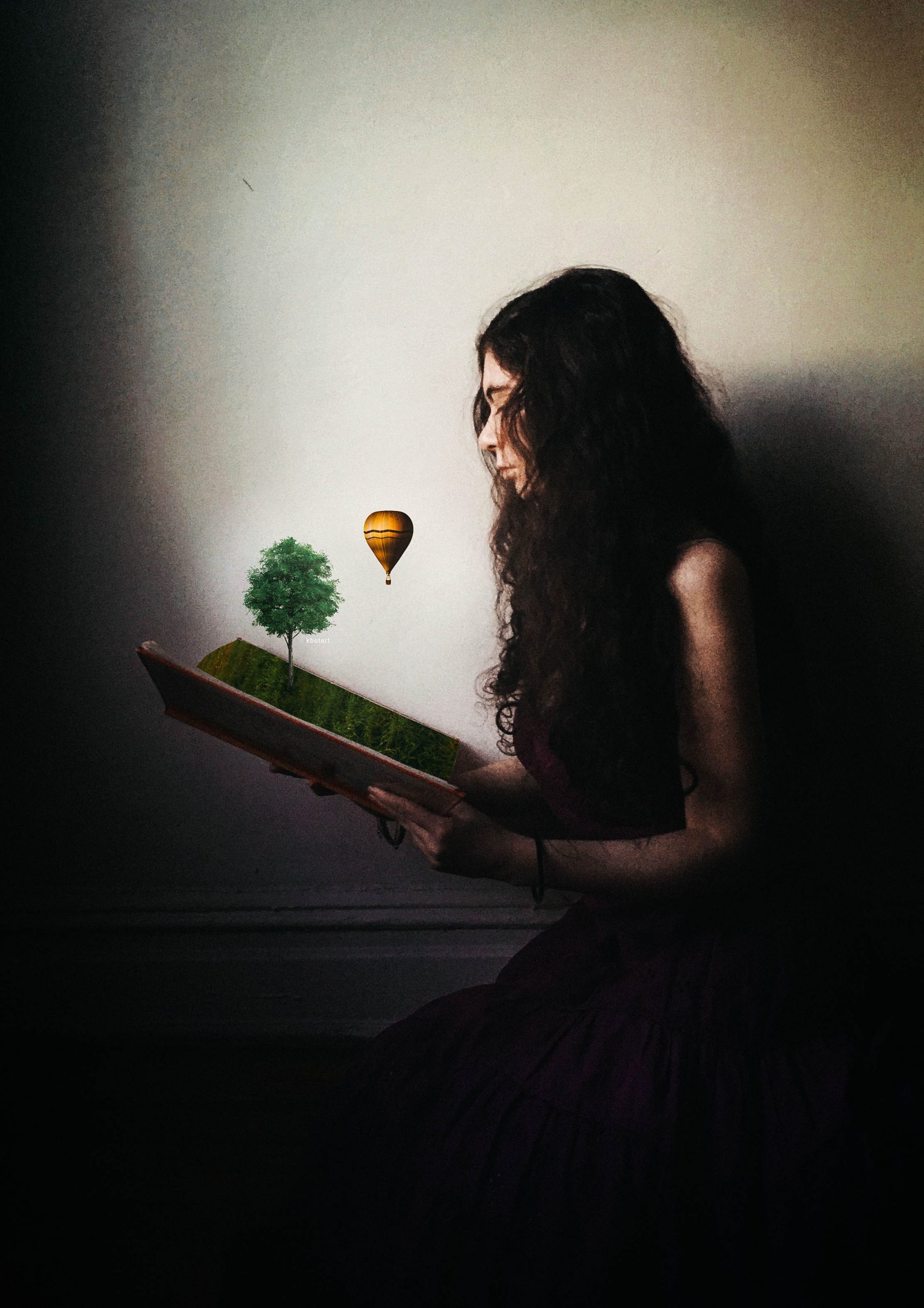 woman holding book open with animated tree and hot air balloon floating out of it