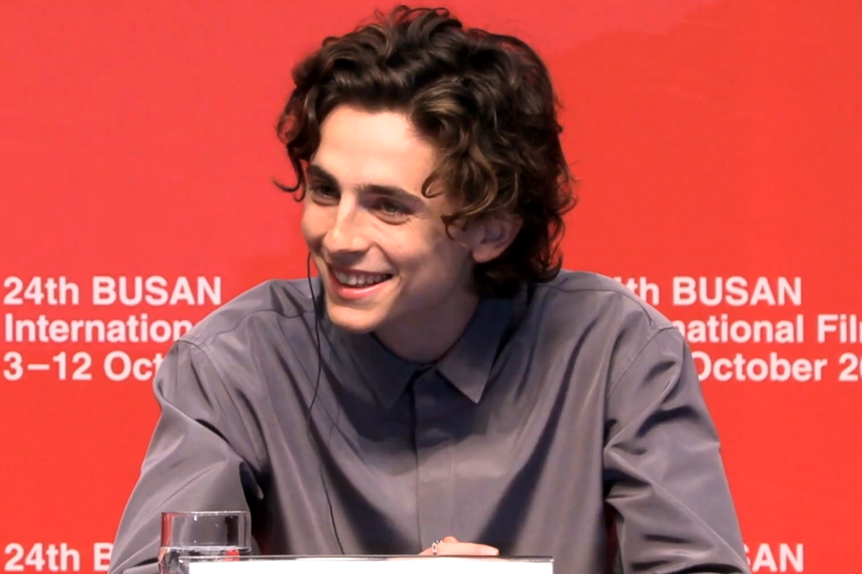 a picture of timothee chalamet smiling
